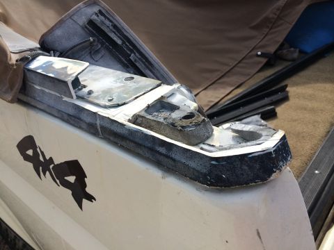 1995 Ford Bronco - Close-up of a trailer hitch mount on a vehicle, showing wear and tear.