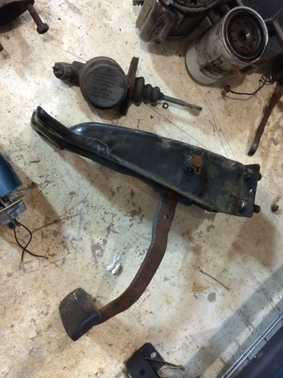 Brake pedal assembly and master cylinder with some text on the cap