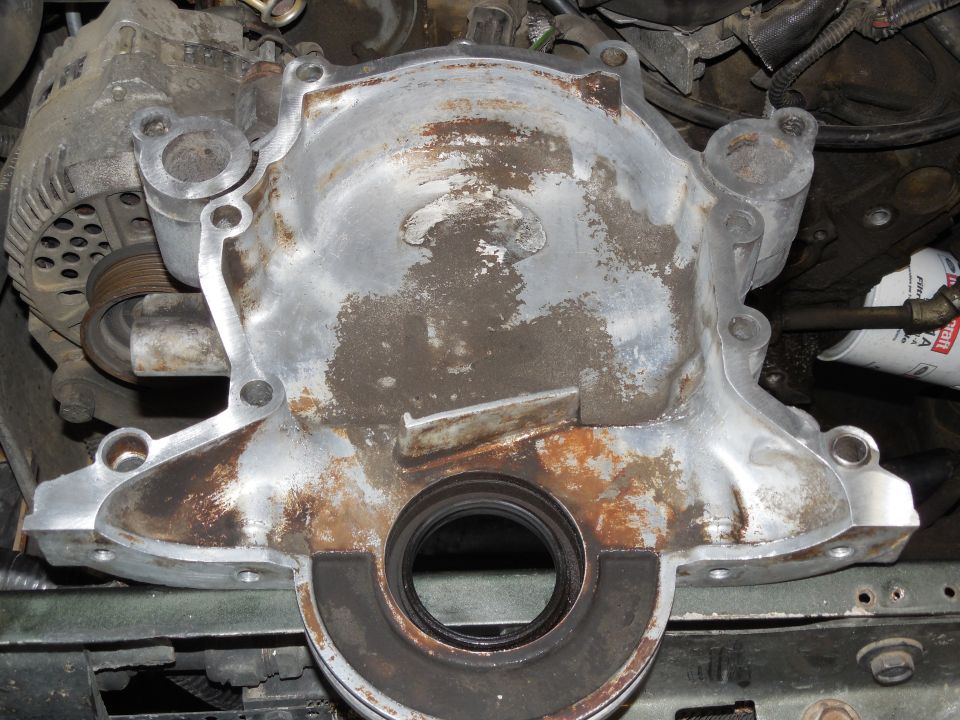 Engine timing cover with a circular oil seal installed