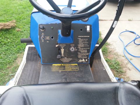 2002 Ford Expedition - Dashboard of a blue lawn tractor, showing controls and operating instructions.