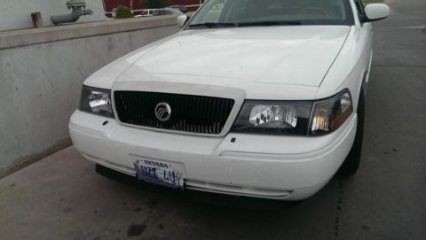 2000 Mercury Grand Marquis - Front view of a white Mercury Grand Marquis parked outdoors.