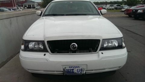 2000 Mercury Grand Marquis - Front view of a white 2000 Mercury Grand Marquis sedan parked outdoors.