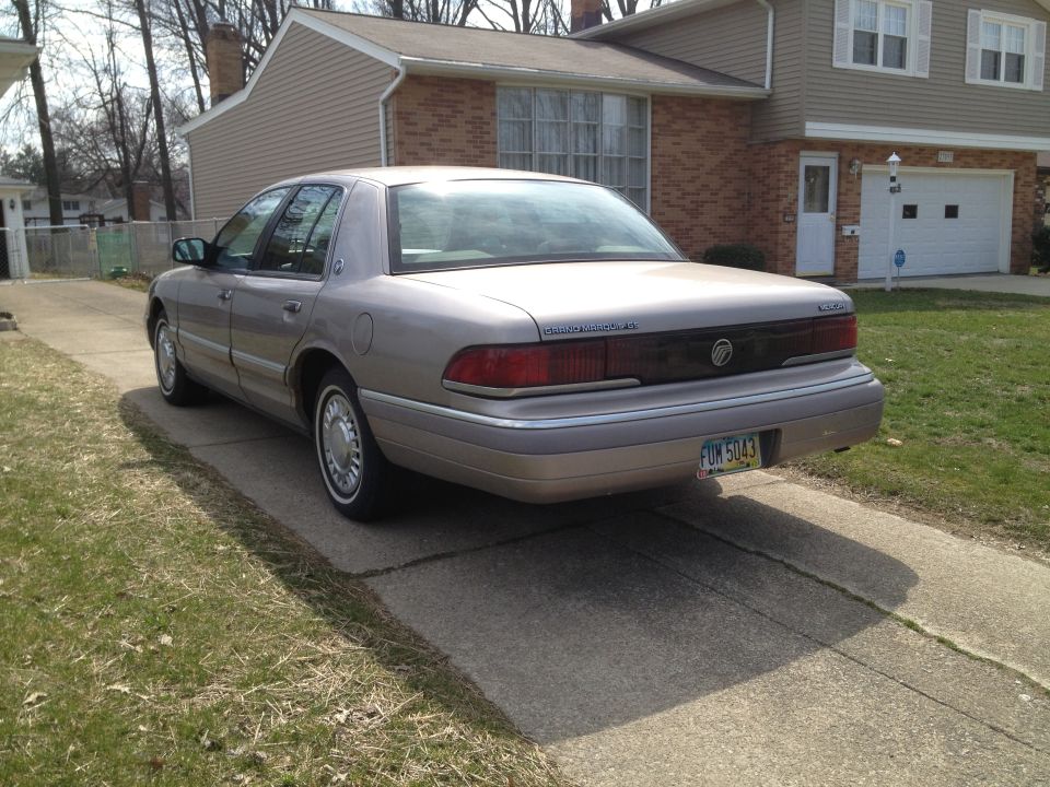Rear view of a 1994 Mercury Grand Marquis parked in a driveway