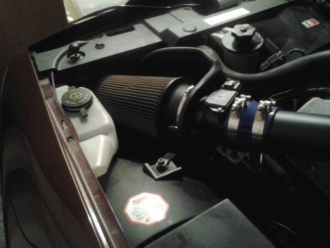 2004 Ford Crown Victoria - Aftermarket air intake system installed in the engine bay, a K&N filter and custom piping.