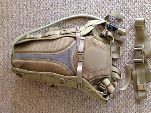 2005 Audi S4 - A tactical hydration backpack with a water bladder tube is shown laid out on a carpeted surface.