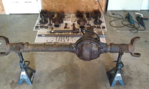 1990 Ford Bronco - Rear axle assembly and associated parts for a Ford Bronco, likely undergoing maintenance or upgrade.