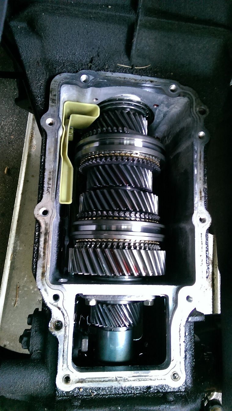 Open transmission housing showing multiple gears and shafts
