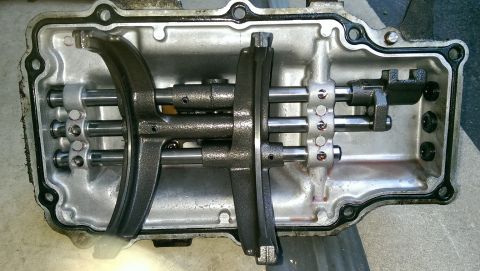 1996 Ford F-150 - Internal components of a vehicle transmission, including shift forks and shafts, are visible.