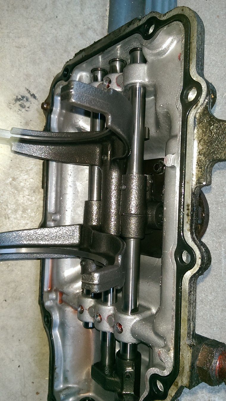 Transmission shifter mechanism with rods and forks