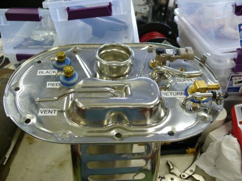 Fuel pump sending unit with labels for black, red, vent, supply, and return lines