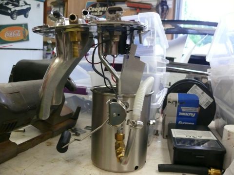 Fuel pump assembly with metal canister and hoses