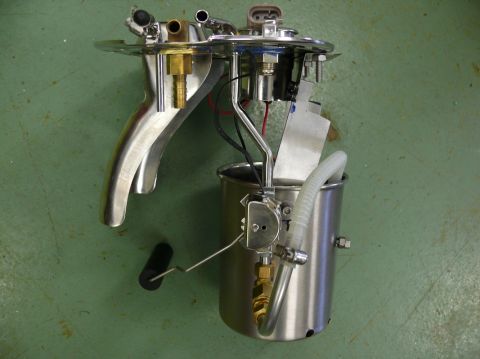 Fuel pump assembly with chrome accents and a float arm