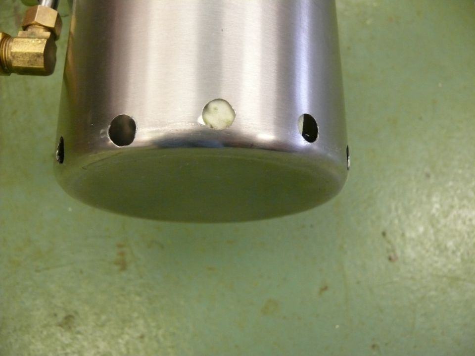 metal canister with holes and brass fittings