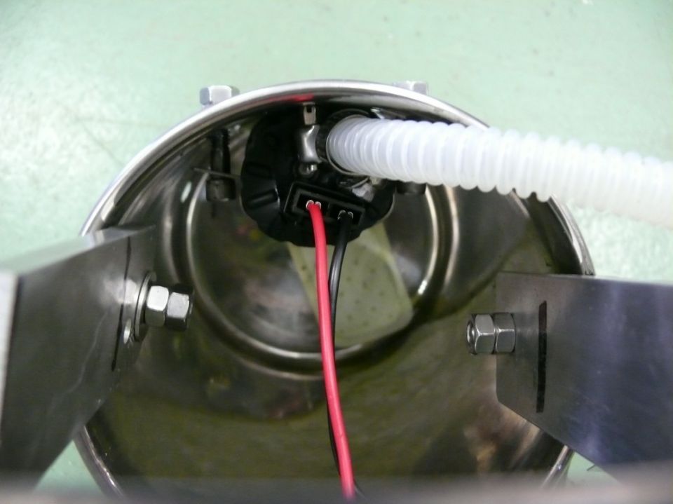 Fuel pump assembly with red and black wires and white hose