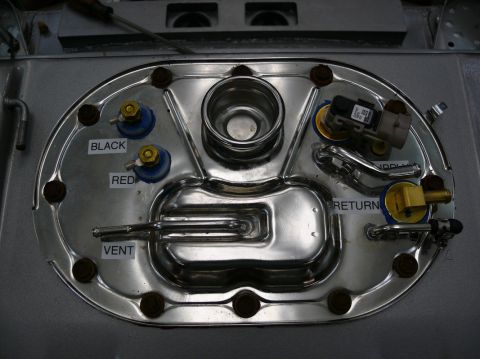 Fuel pump sending unit with labels for black, red, vent, and return lines