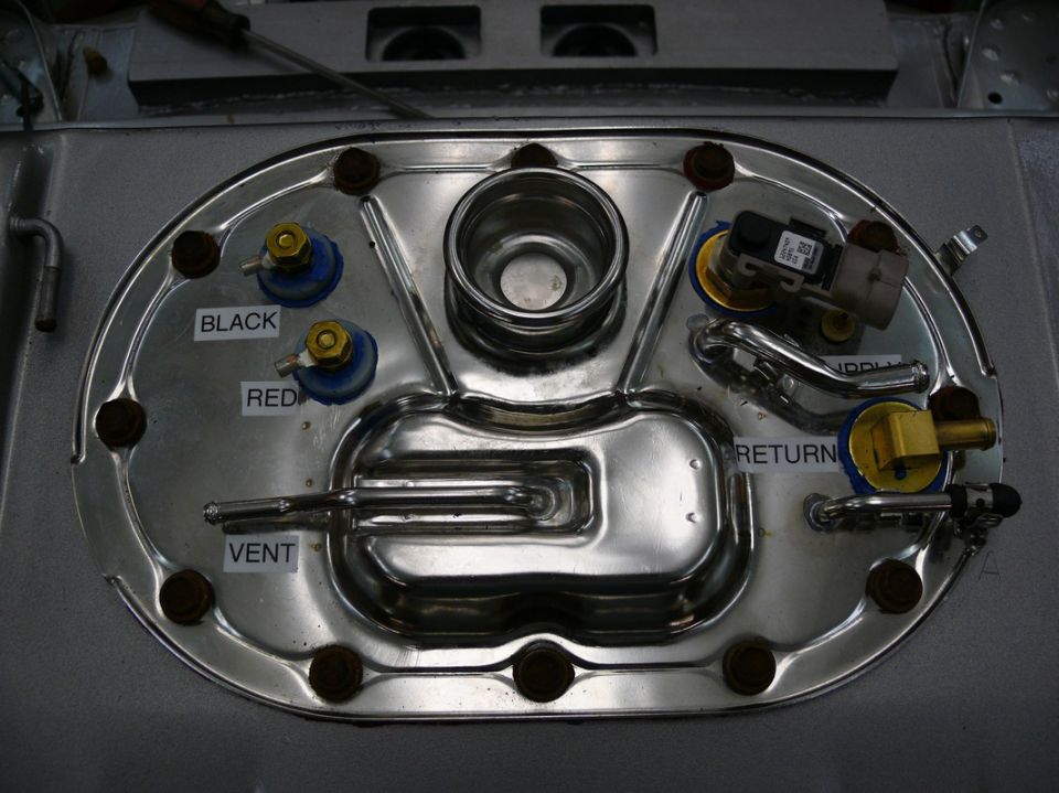 Fuel pump sending unit with labels for black, red, vent, and return lines