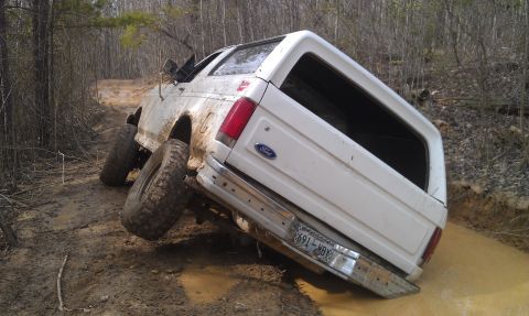 1990 Ford Bronco - This 1990 Ford Bronco is stuck in the mud on an off-road trail.