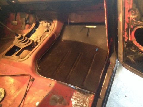 1978 Ford Bronco - Interior view of a 1978 Ford Bronco, focusing on the floor and transmission tunnel area.