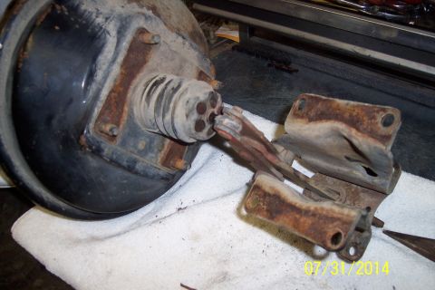 1978 Ford Bronco - A brake booster and its associated mounting hardware are shown, resting on a white cloth.