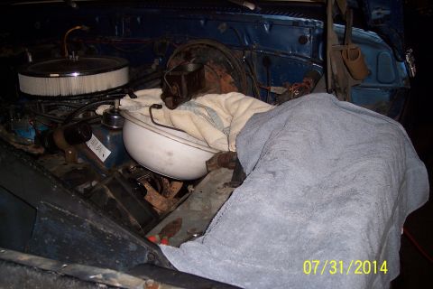 1978 Ford Bronco - Engine bay components are covered with towels, obscuring details of the vehicle.