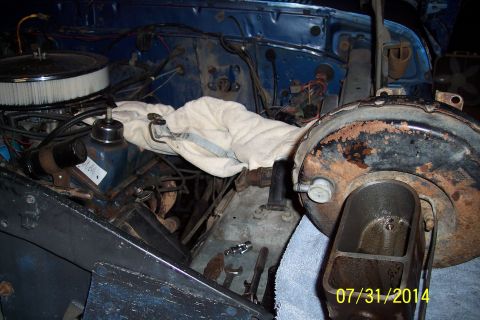 1978 Ford Bronco - Close-up of the engine bay of a 1978 Ford Bronco, focusing on the brake booster and master cylinder assembly.