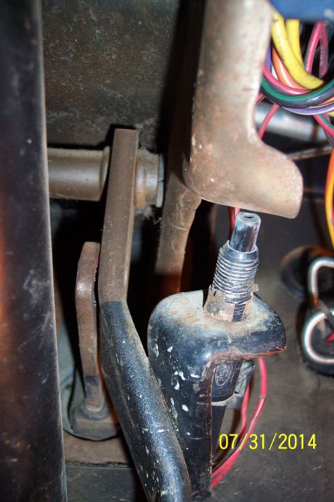 1978 Ford Bronco - Close-up view of a vehicle's brake pedal assembly, showing mechanical components and electrical wiring.