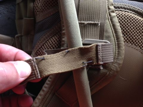 2005 Audi S4 - Close-up of a backpack strap being secured with metal staples.