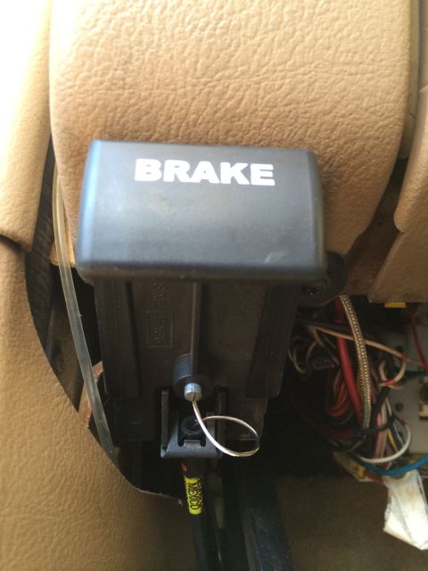 1997 Dodge 3500 - Close-up of a parking brake lever inside a vehicle, showing wiring and interior trim.