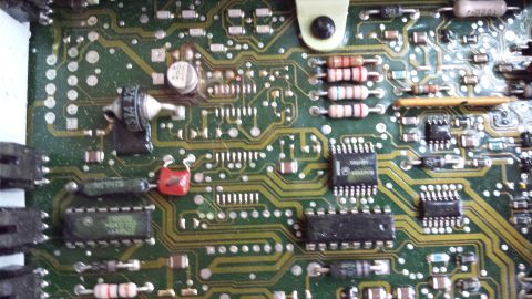 1992 Ford Bronco - Electronic circuit board with visible components and some readable text.