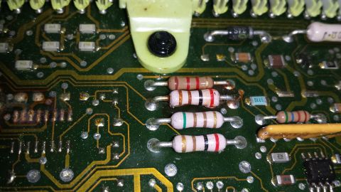 1992 Ford Bronco - A close-up view of electronic components on a circuit board, showing resistors and traces.