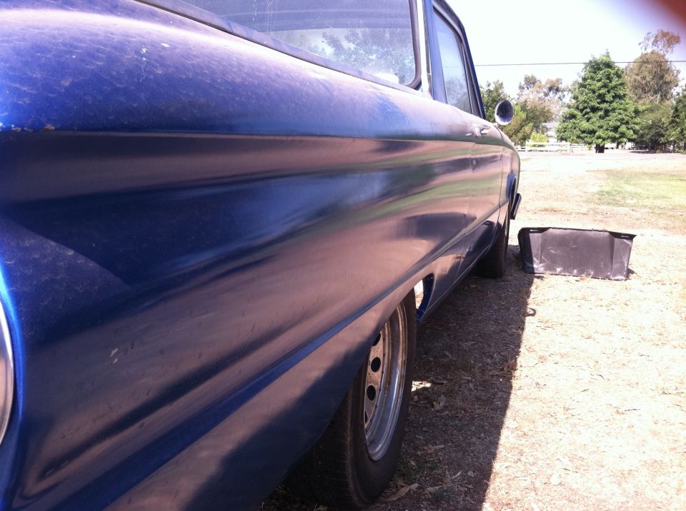1963 Ford Ranchero side profile, blue paint, steel wheels