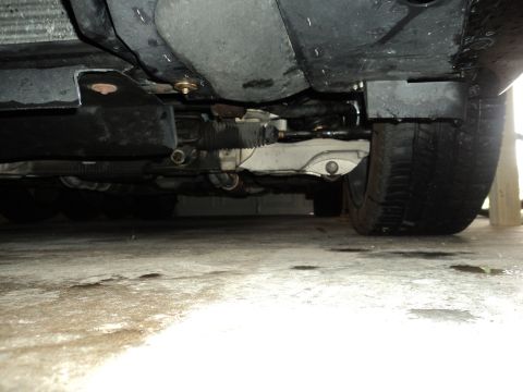 2004 Mercury Grand Marquis - A low-angle shot reveals the complex mechanical components beneath a vehicle's chassis.