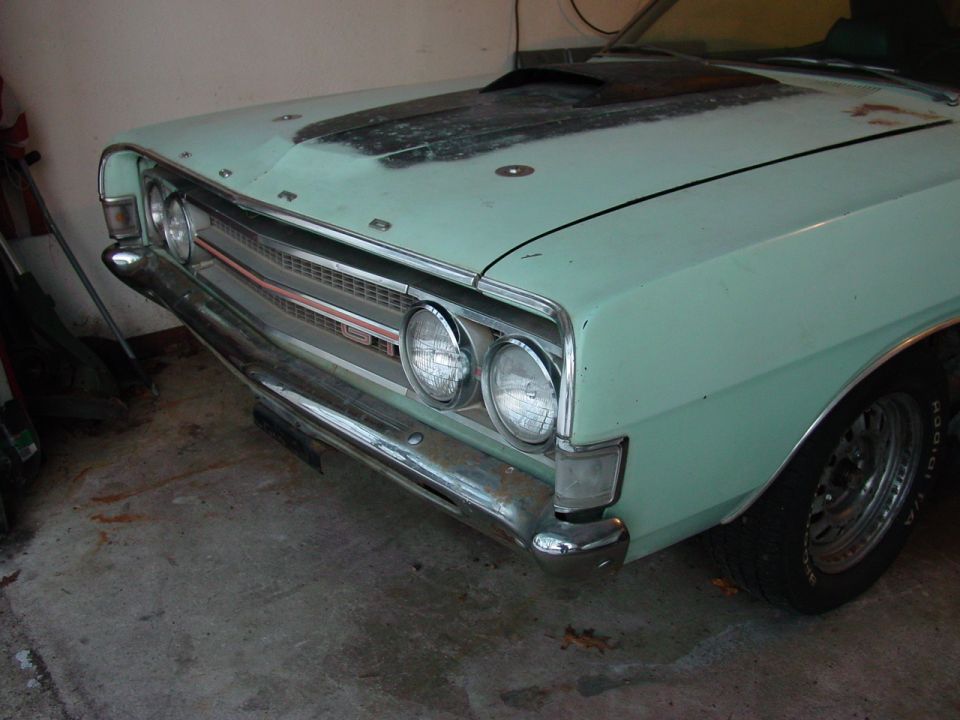 1969 Ford Torino front end, light green paint, hood scoop, chrome bumper, grille detail