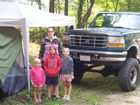 1996 Ford Bronco - Family poses with their 1996 Ford Bronco during an outdoor gathering.