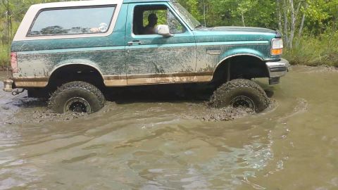 1996 Ford Bronco - This 1996 Ford Bronco navigates through a muddy off-road course.