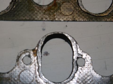 1979 Ford Ranchero - Close-up of a used exhaust manifold gasket, indicating wear and potential for leaks.