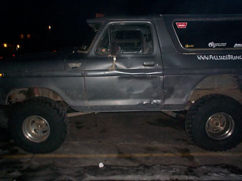 1979 Ford Bronco - This 1978 Ford Bronco has a dented driver's door and off-road tires.