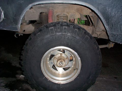1979 Ford Bronco - Off-road tire and suspension details are visible in this close-up shot.