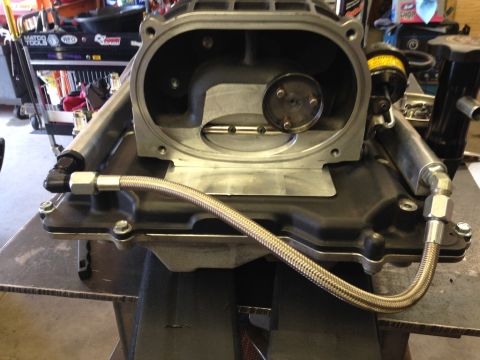 2010 Dodge Challenger - Close-up view of a supercharger assembly, likely undergoing maintenance or a reseal.