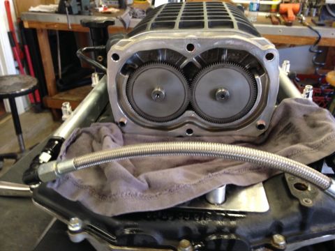 2010 Dodge Challenger - Supercharger rotors are visible inside the housing, with a braided hose in the foreground.