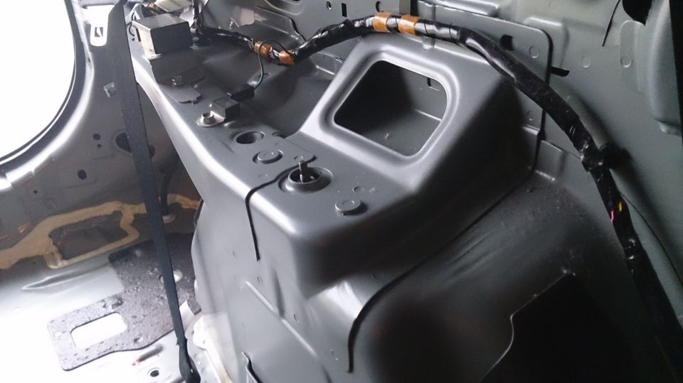 Interior metal structure with wiring and a seatbelt strap