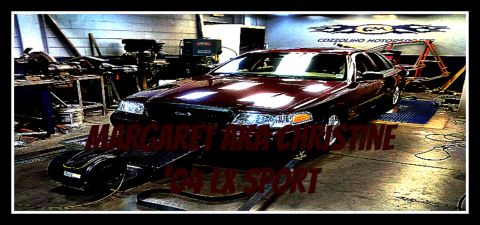 2004 Ford Crown Victoria - A maroon Ford Crown Victoria is positioned on a dynamometer inside a workshop, with text overlay indicating it's 'Margaret's car'.