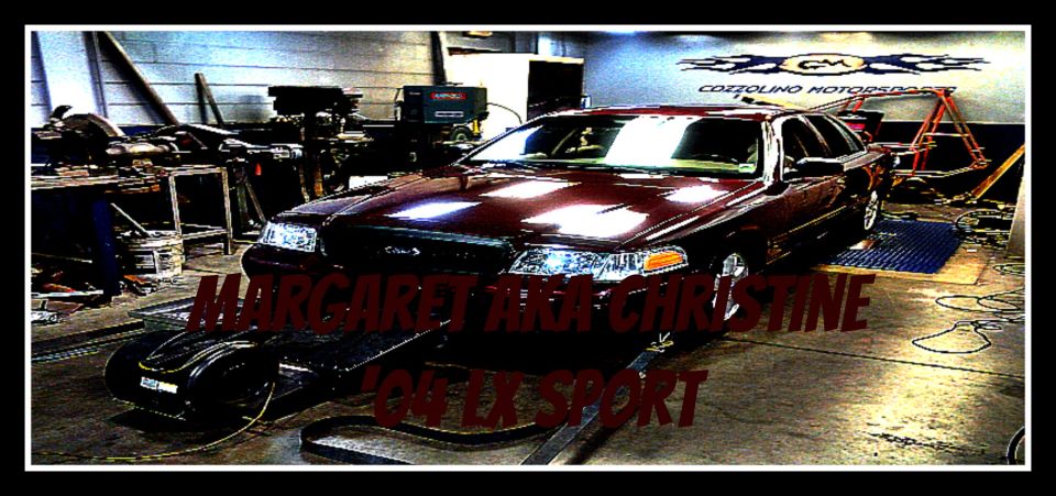 Dark red Ford Crown Victoria on a chassis dyno with MARGARET AKA CHRISTINE '04 LX SPORT text