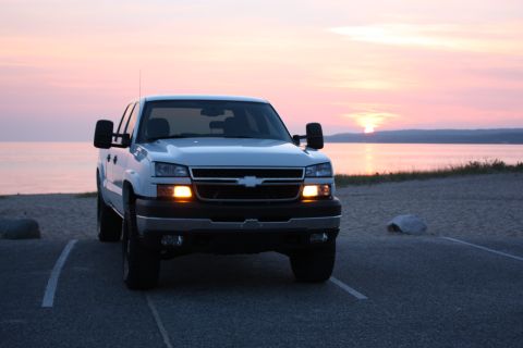 2006 Chevrolet Silverado 2500 - Front view of a 2006 Chevrolet Silverado 2500 pickup truck at dusk near the water.