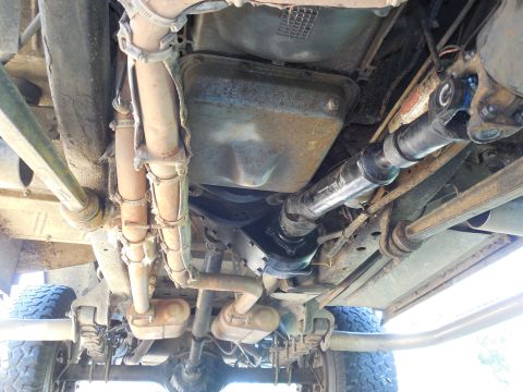 1975 Ford Bronco - Fresh reman t-case Note the extra holes on the bottom face of the frame behind the radius arm nut which I added to install the nuts for the…
