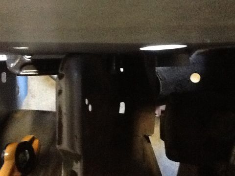 1988 Suzuki Samurai - This image shows the underside of a vehicle, focusing on structural components and possibly suspension parts.