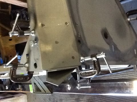 1988 Suzuki Samurai - Close-up of a vehicle frame section being worked on, secured with C-clamps, with a Supermotors.net watermark visible.