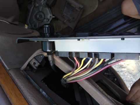1997 Ford F-350 - A bundle of wires is connected to a component inside the vehicle's dashboard area.