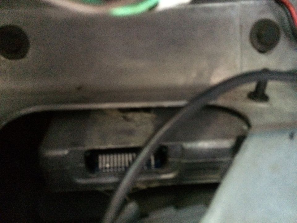 Close-up of a vehicle's dashboard showing a vent and some wiring