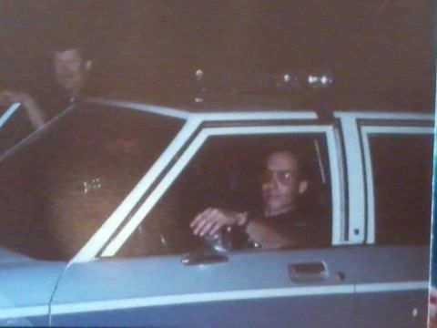 1991 Ford LTD Crown Victoria - Driver behind the wheel of a 1991 Ford Crown Victoria LTD police car.